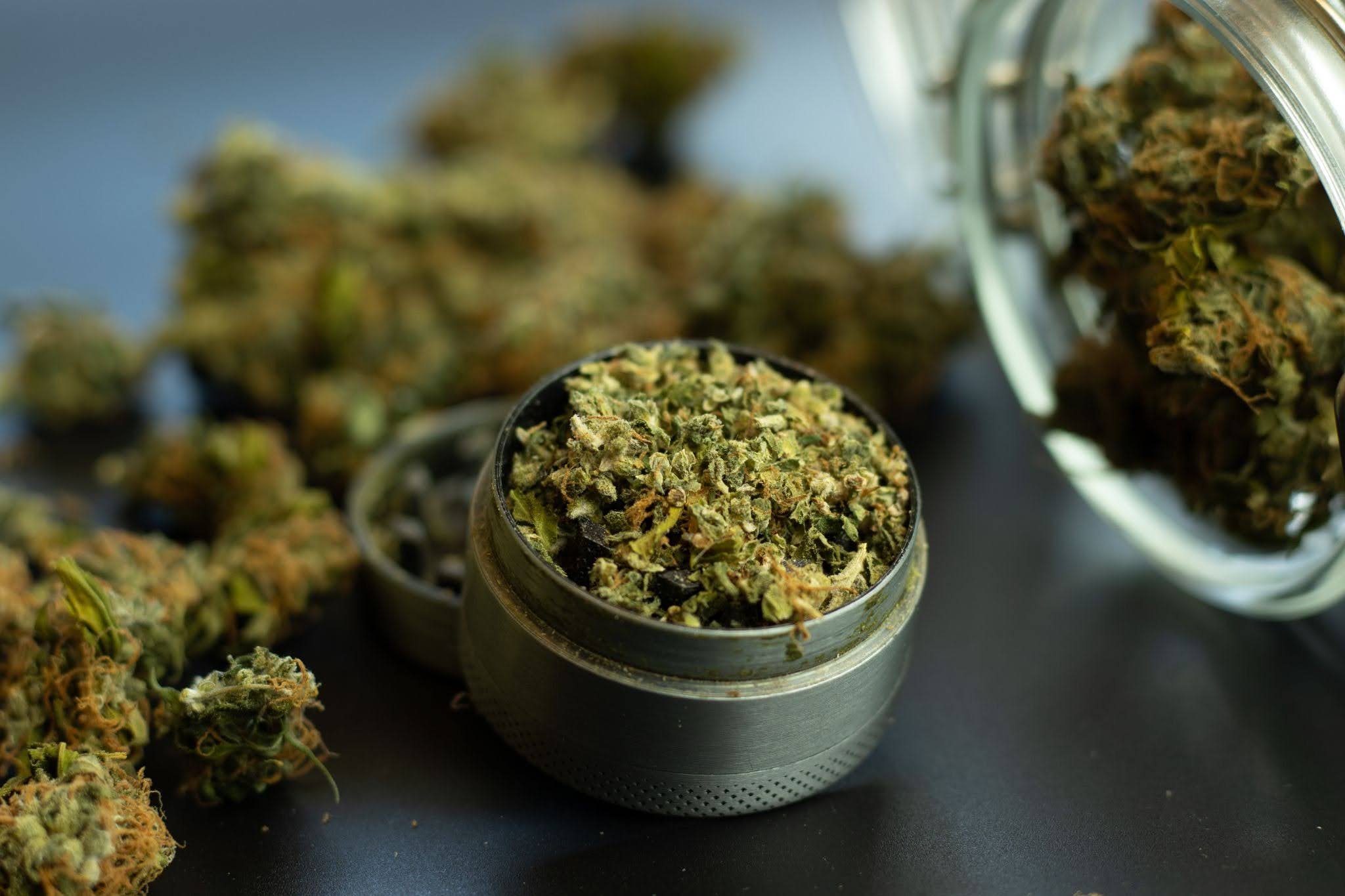 Weed in grinder and jar.